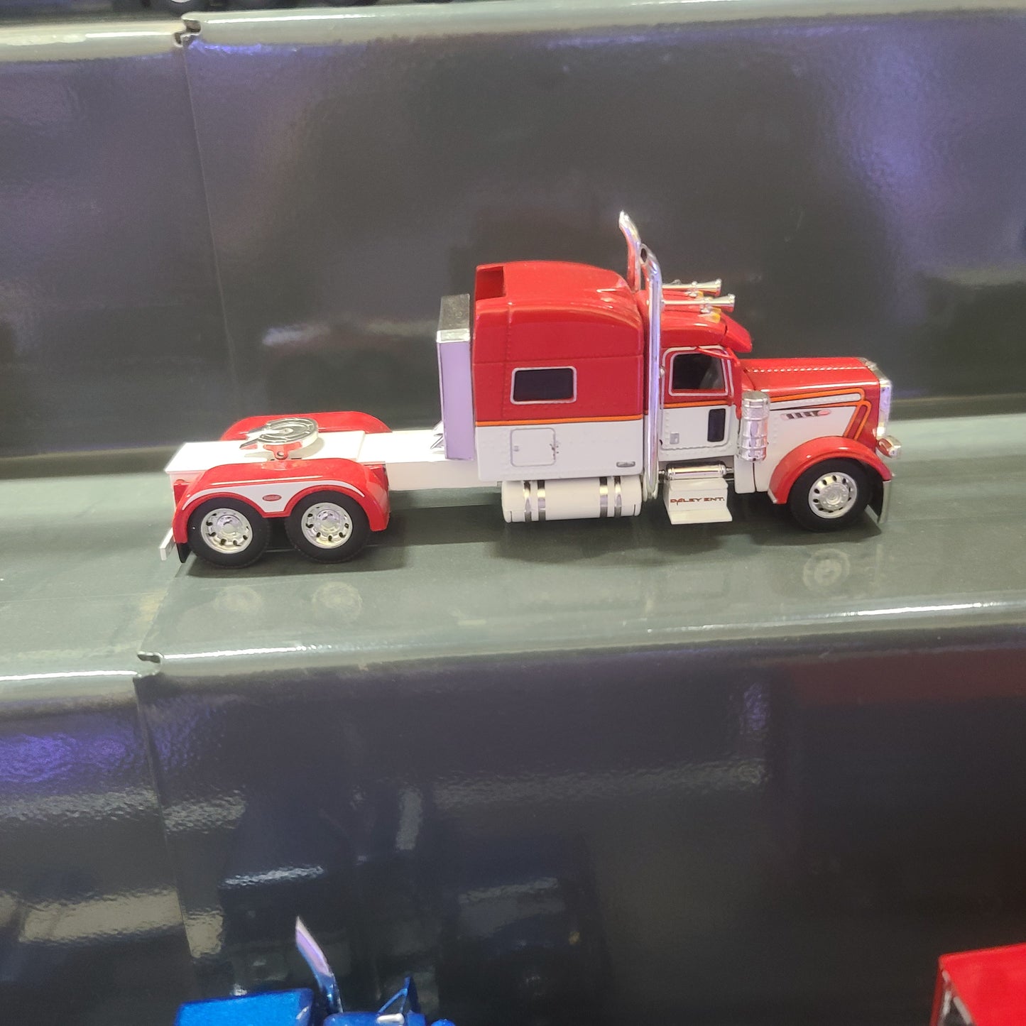 1:64 DCP Cab Only Peterbilt 389, red, white and orange, standtup sleeper, Daley Ent