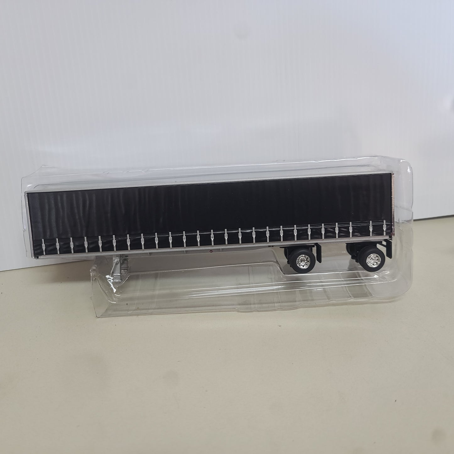 1:64 DCP Trailer Only spread axel, Hard sided Curtain Trailer, Black