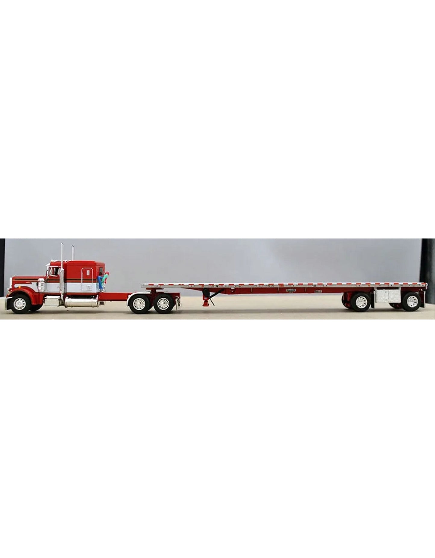 1:64 DCP Peterbilt 359 63" Flattop sleeper with Wilson spread axle flatbed