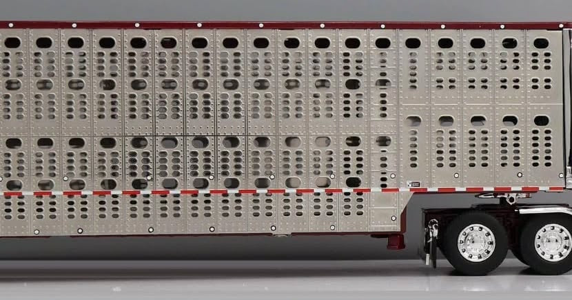 1:64 DCP Orange Red and Gray Peterbilt 379 with Wilson Spread Axle Cattle Trailer Coffey Farms