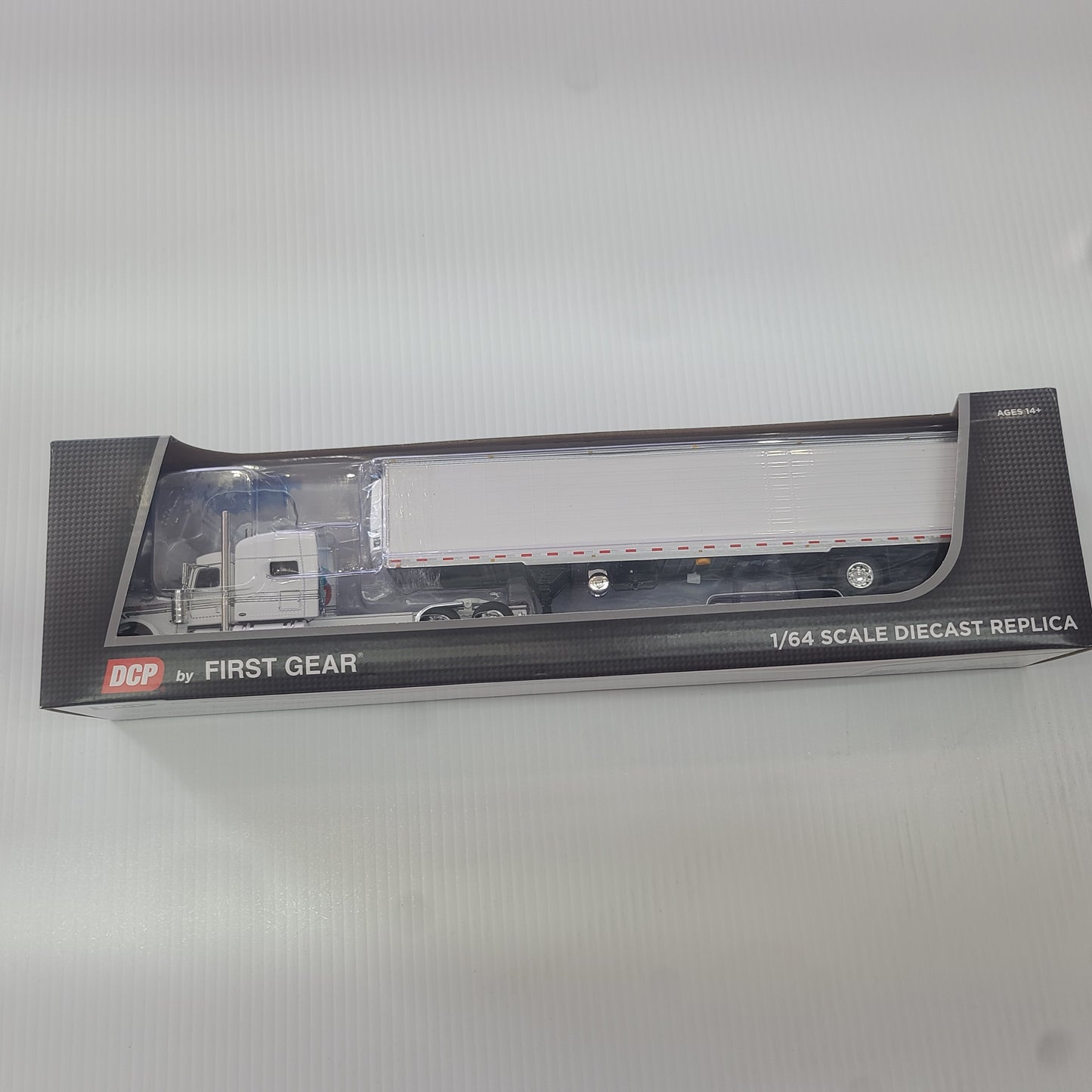 1:64 DCP White Peterbilt 389 70" Sleeper Cab Long Frame w Reefer Trailer