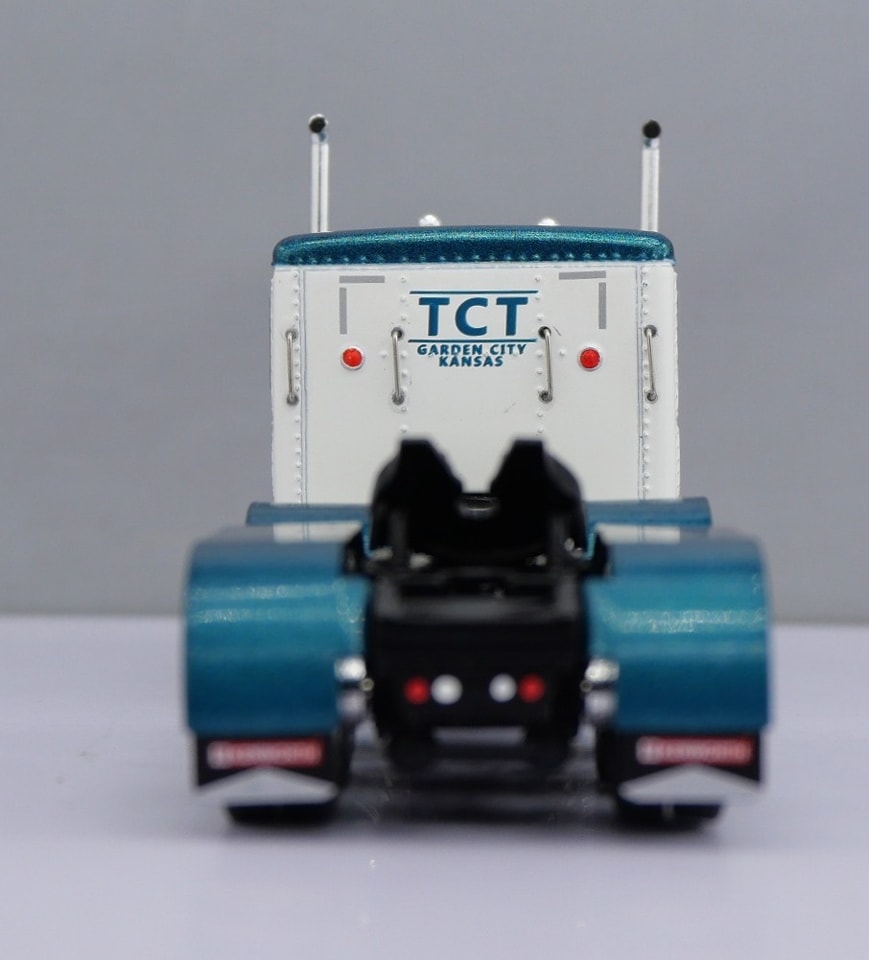 1:64 DCP W900L with 60" flat top sleeper and Polar deep drop tank trailer (Teal)