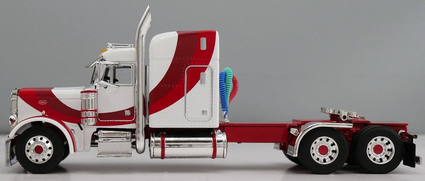1:64 DCP White red and burgundy Peterbilt 379 with Wilson Spread Axle Cattle Trailer