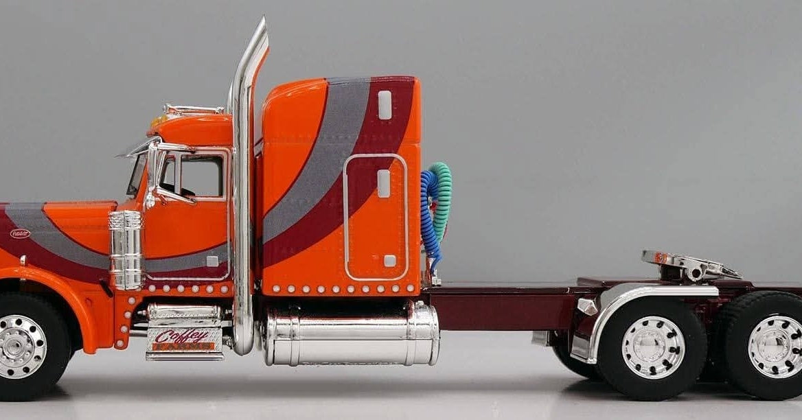 1:64 DCP Orange Red and Gray Peterbilt 379 with Wilson Spread Axle Cattle Trailer Coffey Farms