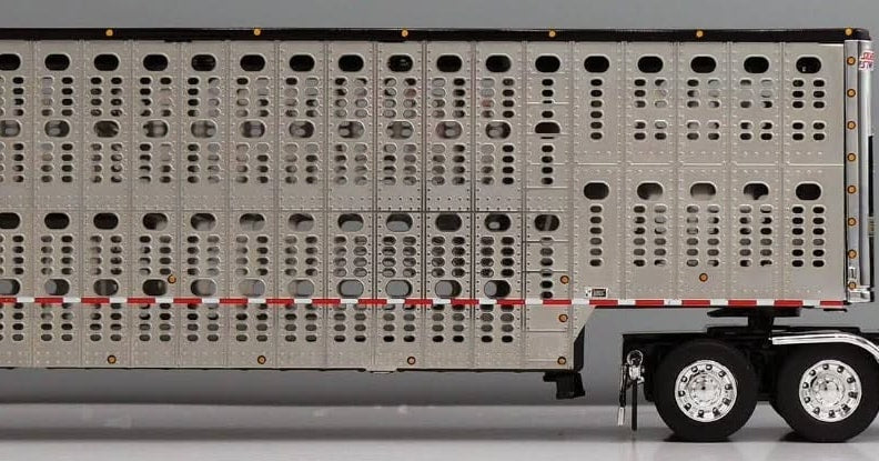 1:64 DCP Black Gray and Silver Peterbilt 379 with Wilson Spread Axle Cattle Trailer SCD