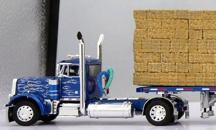 1:64 DCP Blue Silver Flames Peterbilt 379 Single Axle Day Cab and Utility Dual 28.5' Flatbed Trailers with Hay Load