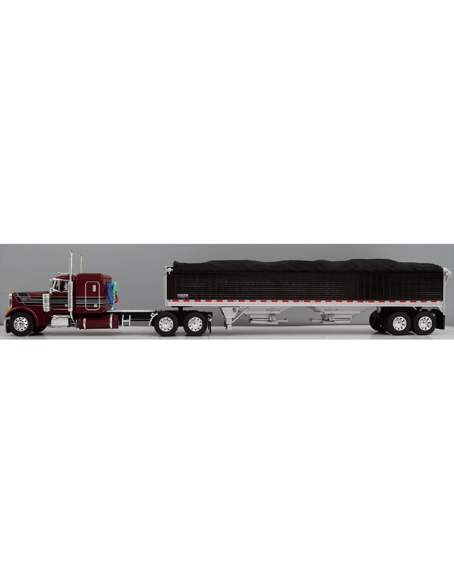 1:64 DCP Red and Black Peterbilt 379 Semi with White 43′ Wilson Pacesetter Grain Trailer