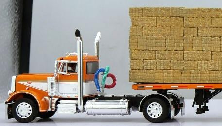 1:64 DCP Orange White Peterbilt 379 Single Axle Day Cab and Utility Dual 28.5' Flatbed Trailers with Hay Load