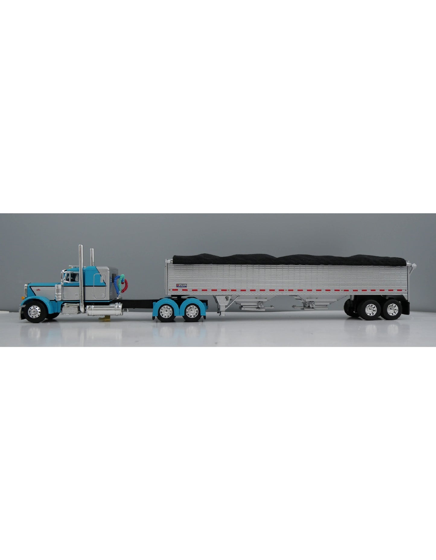 1:64 DCP Peterbilt 379 with 48" Flattop Sleeper and Wilson High Sided Grain Trailer, Baby Blue with Silver stripe